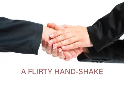 Two handed handshake flirting