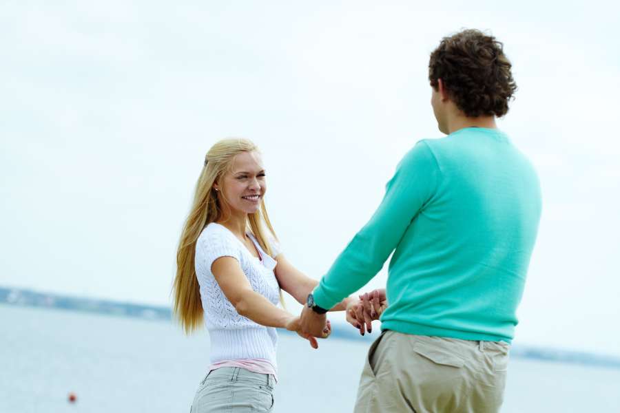 Two-handed handshake flirting Technique